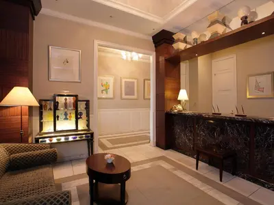 a living room with a couch and a table at Hotel Monterey Lasoeur Ginza in Tokyo