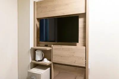 a room with a flat screen tv on a wall at Washington R&B Hotel Higashi Nihonbashi in Tokyo