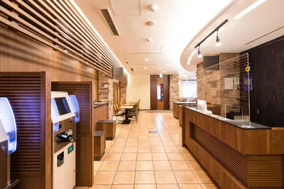 a restaurant lobby with a counter and some chairs at Washington R&B Hotel Higashi Nihonbashi in Tokyo