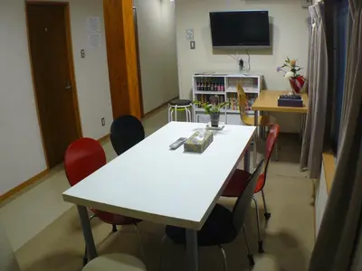 a conference room with a white table and chairs at Hotel Meigetsu in Tokyo