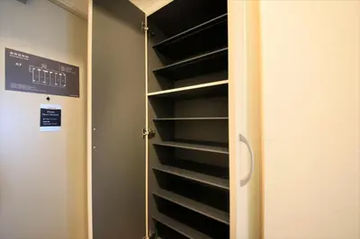 a closet with empty shelves in a room at Bay Hotel Urayasu-ekimae in Urayasu