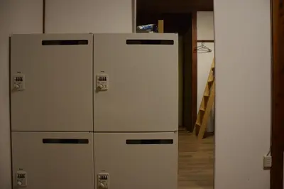 two old refrigerators are sitting in a room at Guest house SHIE SHIMI in Tokyo