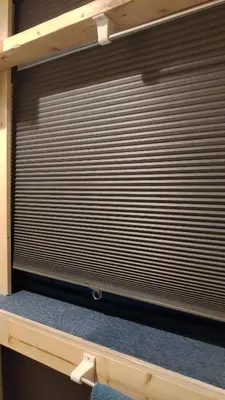 a large metal garage door in a room at Base Inn Uguisudani in Tokyo