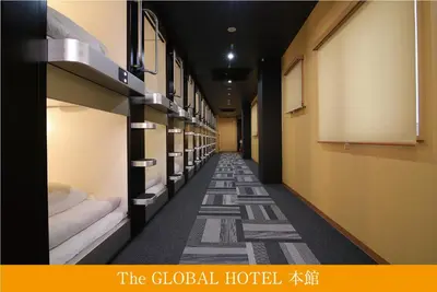 a hallway with a row of bunk beds at The Global Hotel Tokyo in Tokyo