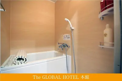 a shower in a bathroom with a shower head at The Global Hotel Tokyo in Tokyo