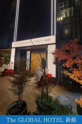 a building with a sign that reads the global hotel at The Global Hotel Tokyo in Tokyo