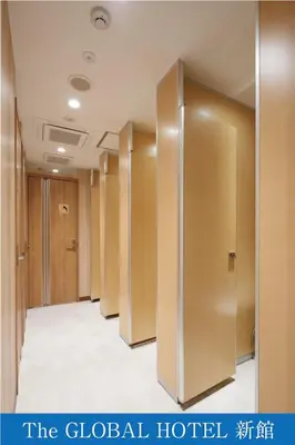 a row of elevators in a hotel room at The Global Hotel Tokyo in Tokyo