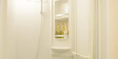 a refrigerator with bottles of alcohol inside of it at Akasakano-sato(Premium) in Tokyo