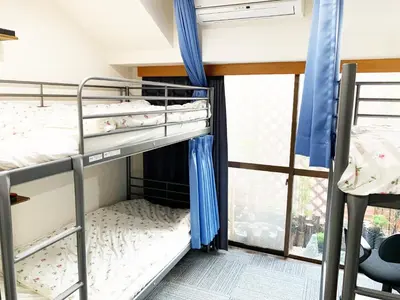 two bunk beds in a room with a window at Akasakano-sato(Premium) in Tokyo