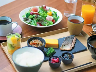 a tray of food with a salad and a plate of food at NOHGA HOTEL UENO TOKYO in Tokyo