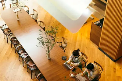 two people sitting at a table with laptops at NOHGA HOTEL UENO TOKYO in Tokyo