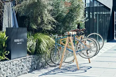 a bike parked on a stand on a sidewalk at NOHGA HOTEL UENO TOKYO in Tokyo
