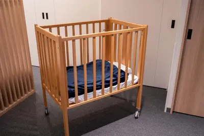 a crib with a blue blanket in a room at MIMARU Tokyo Ueno East in Tokyo