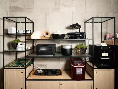 a kitchen with black shelves and a microwave at MIMARU Tokyo Ueno Inaricho in Tokyo