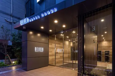 a building with a sign on the side of it at Belken Hotel Kanda in Tokyo