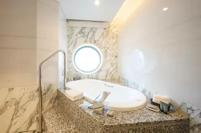 a bathroom with a tub and a sink at Marunouchi Hotel in Tokyo