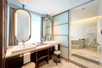 a bathroom with two sinks and a large mirror at Marunouchi Hotel in Tokyo