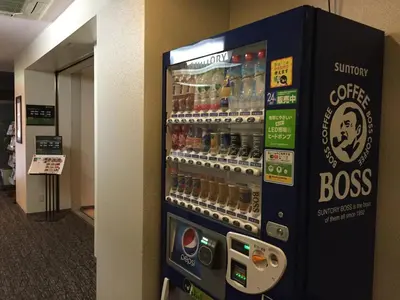 a vending machine filled with bottles of beer at Ueno Terminal Hotel in Tokyo