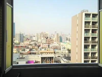 a view of a city from a window at MIKO'S APT Iconic Shinjuku, lively Skyscraper view Tokyo, 10th fl, 3mins to Station 新宿 大久保のマンションで暮らす 駅チカ高層眺望 東京を楽しむ食べ歩き in Tokyo