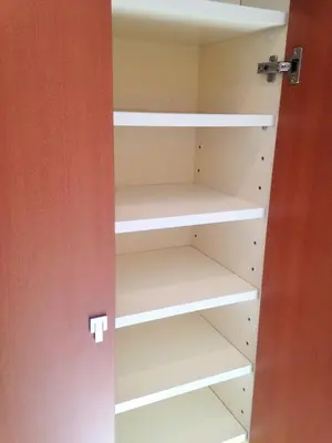 a closet in a room with white shelves at MIKO'S APT Iconic Shinjuku, lively Skyscraper view Tokyo, 10th fl, 3mins to Station 新宿 大久保のマンションで暮らす 駅チカ高層眺望 東京を楽しむ食べ歩き in Tokyo