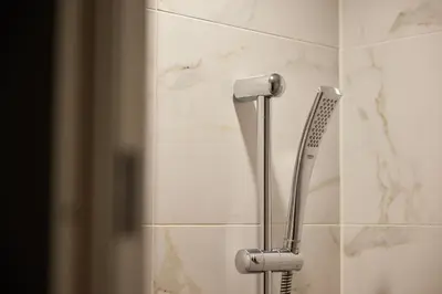 a toothbrush holder in a bathroom with marble tiles at SHIBUYA STREAM HOTEL formerly Shibuya Stream Excel Hotel Tokyu in Tokyo