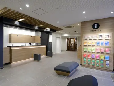 a waiting area of a pharmacy with a pharmacyacistasteryasteryasteryasteryasteryastery at Tokyo Inn in Tokyo
