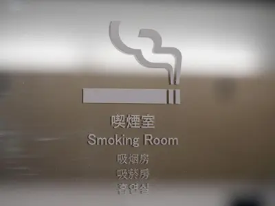 a close up of a smoking room logo on a phone at Tokyo Inn in Tokyo