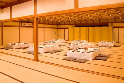 a large room with tables with white table settings at Tokyo Grand Hotel in Tokyo