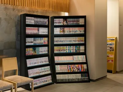 a book shelf filled with books in a library at Best Western Hotel Fino Tokyo Akihabara in Tokyo