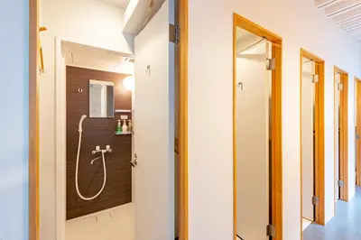 a bathroom with a shower in a room at plat hostel keikyu asakusa station in Tokyo