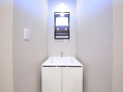 a bathroom with a white sink and a mirror at COTO Tokyo Asakusa 5 in Tokyo