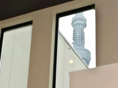 a view of the oriental pearl tower seen through a window at COTO Tokyo Asakusa 5 in Tokyo