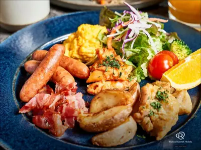 a blue plate of food with meat and vegetables at Daiwa Roynet Hotel Nishi-Shinjuku PREMIER in Tokyo