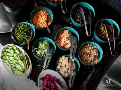 a table topped with blue bowls filled with different types of food at Daiwa Roynet Hotel Nishi-Shinjuku PREMIER in Tokyo