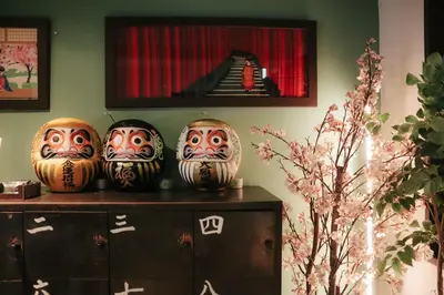 a group of vases sitting on top of a shelf at waves nakameguro in Tokyo