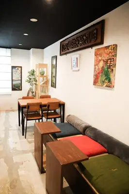 a living room with a couch and a table at waves nakameguro in Tokyo
