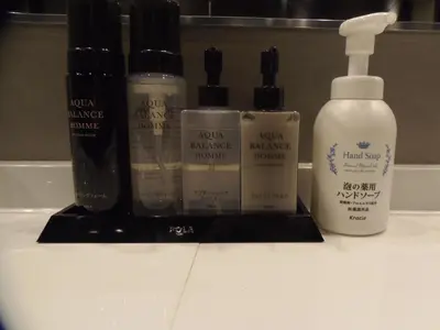a group of products sitting on a bathroom counter at The Nell Ueno Okachimachi in Tokyo