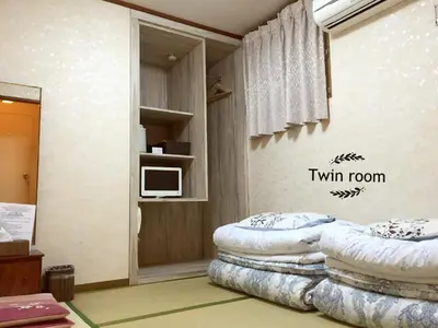 a room with two pillows sitting on the floor at Asakusa Ryokan Toukaisou in Tokyo