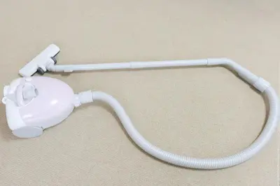 a white phone with a cord on the floor at HIROKI Building in Tokyo