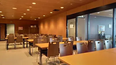 a dining room with tables and chairs at Tokyo Central Youth Hostel in Tokyo