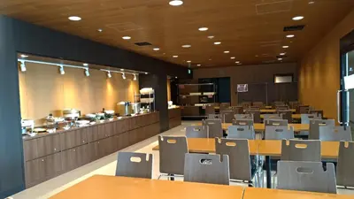 a restaurant with tables and chairs in a room at Tokyo Central Youth Hostel in Tokyo