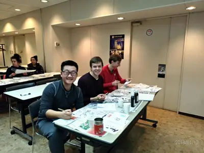 a group of people sitting at tables at Tokyo Central Youth Hostel in Tokyo