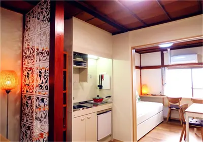 a room with a kitchen and a bed and a table at Kiki HouseT --Self Check-in -- Room Number & Password is in the following email in Tokyo