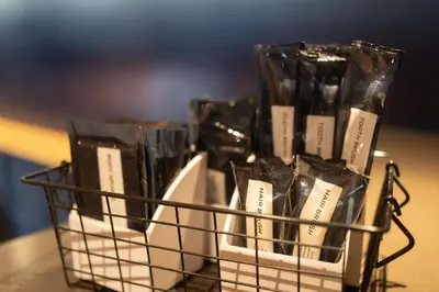 a basket filled with black bags on a table at Hotel New Shohei in Tokyo