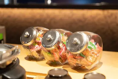 three plastic containers filled with food on a table at Hotel New Shohei in Tokyo