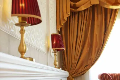 two lamps sitting on top of a bed next to a curtain at Tokyo Bay Maihama Hotel First Resort in Urayasu