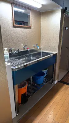 a kitchen with a sink in a room at Ryokan Nakadaya in Tokyo
