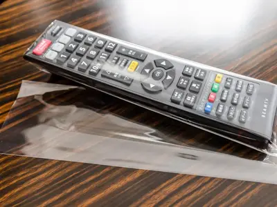 a remote control sitting on top of a table at APA Hotel Tokyo Kudanshita in Tokyo