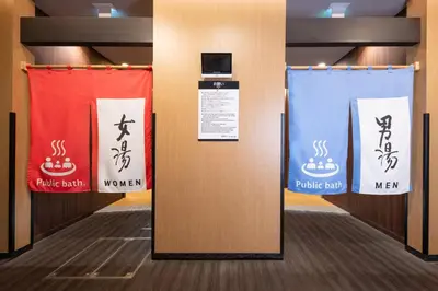 a room with a partition with signs on it at APA Hotel & Resort Tokyo Bay Shiomi in Tokyo
