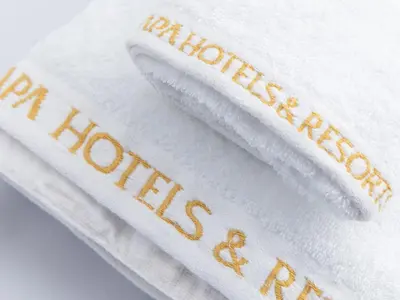 two white towels with the words houston certificates on them at APA Hotel Tokyo Ojima in Tokyo